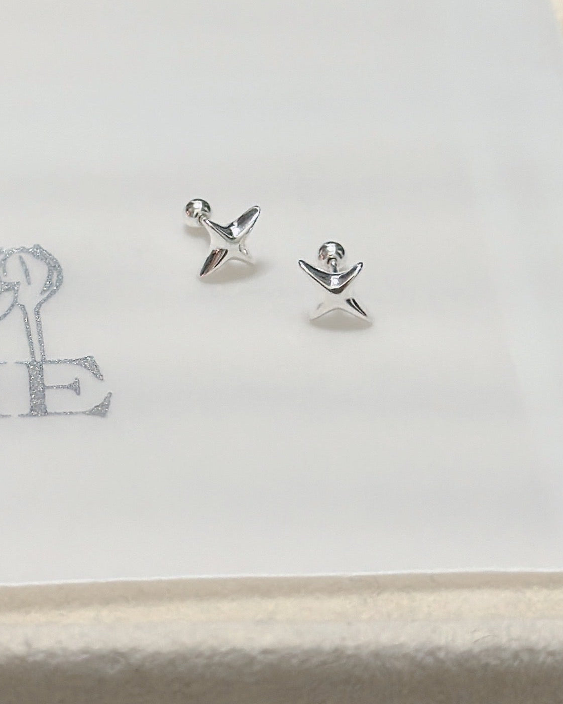#668 | Cross Star Piercing - Screw-back | 925 Silver