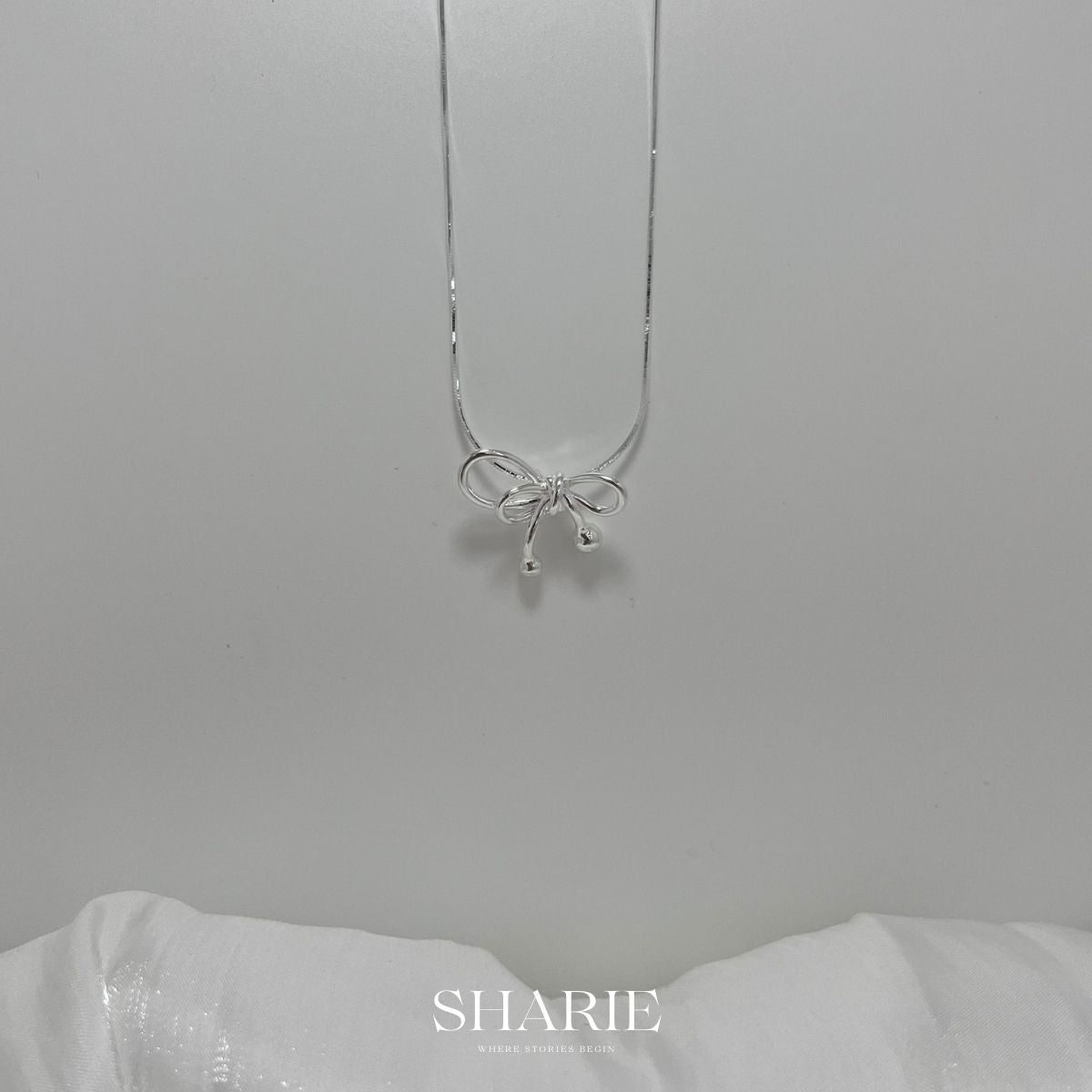 Discover the enchanting P00257-PN0055 Ribbon Snake Chain Necklace in premium 925 silver. Fluid snake chain entwines with delicate ribbon motifs, blending serpentine grace and whimsical elegance for timeless sophistication and everyday luxury.

#P00257Necklace #RibbonSnakeChain #925SilverJewelry #SnakeChainNecklace #RibbonPendant #FashionNecklace #SilverSnake #LuxuryAccessories #ElegantChain #WhimsicalJewelry

#P00257項鍊 #緞帶蛇鏈 #925銀飾 #蛇鏈項鍊 #緞帶吊墜 #時尚項鍊 #銀蛇鏈 #奢華配件 #優雅鏈 #奇幻珠寶