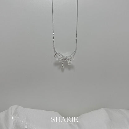 Discover the enchanting P00257-PN0055 Ribbon Snake Chain Necklace in premium 925 silver. Fluid snake chain entwines with delicate ribbon motifs, blending serpentine grace and whimsical elegance for timeless sophistication and everyday luxury.

#P00257Necklace #RibbonSnakeChain #925SilverJewelry #SnakeChainNecklace #RibbonPendant #FashionNecklace #SilverSnake #LuxuryAccessories #ElegantChain #WhimsicalJewelry

#P00257項鍊 #緞帶蛇鏈 #925銀飾 #蛇鏈項鍊 #緞帶吊墜 #時尚項鍊 #銀蛇鏈 #奢華配件 #優雅鏈 #奇幻珠寶