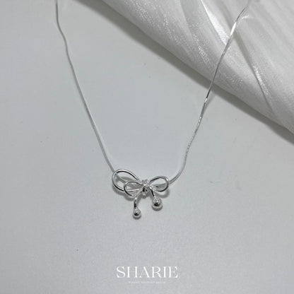 Discover the enchanting P00257-PN0055 Ribbon Snake Chain Necklace in premium 925 silver. Fluid snake chain entwines with delicate ribbon motifs, blending serpentine grace and whimsical elegance for timeless sophistication and everyday luxury.

#P00257Necklace #RibbonSnakeChain #925SilverJewelry #SnakeChainNecklace #RibbonPendant #FashionNecklace #SilverSnake #LuxuryAccessories #ElegantChain #WhimsicalJewelry

#P00257項鍊 #緞帶蛇鏈 #925銀飾 #蛇鏈項鍊 #緞帶吊墜 #時尚項鍊 #銀蛇鏈 #奢華配件 #優雅鏈 #奇幻珠寶