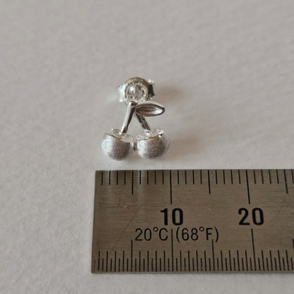 Indulge in playful charm with E43 Cherry Earrings, exquisitely crafted in 925 silver. This Korea-inspired accessory features dainty cherry drops, blending cute and chic for daily wear or gifting. Hypoallergenic, lightweight, and radiant—add a fruity pop of elegance to any look with timeless sophistication.

#SilverEarrings, #925SterlingSilver, #SterlingSilverEarrings, #SilverJewelry, #HandmadeEarrings, #StatementEarrings, #EarringStyle, #MinimalistEarrings, #FashionJewelry, #JewelryAddict