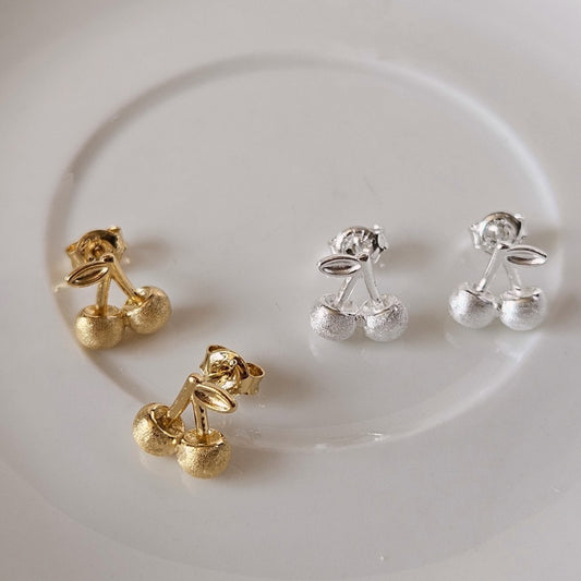 Indulge in playful charm with E43 Cherry Earrings, exquisitely crafted in 925 silver. This Korea-inspired accessory features dainty cherry drops, blending cute and chic for daily wear or gifting. Hypoallergenic, lightweight, and radiant—add a fruity pop of elegance to any look with timeless sophistication.

#SilverEarrings, #925SterlingSilver, #SterlingSilverEarrings, #SilverJewelry, #HandmadeEarrings, #StatementEarrings, #EarringStyle, #MinimalistEarrings, #FashionJewelry, #JewelryAddict